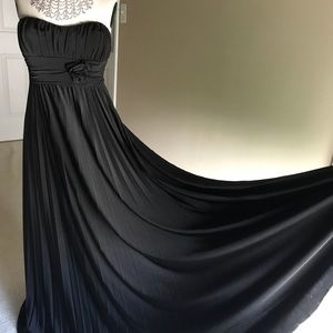 Woman’s black strapless gown